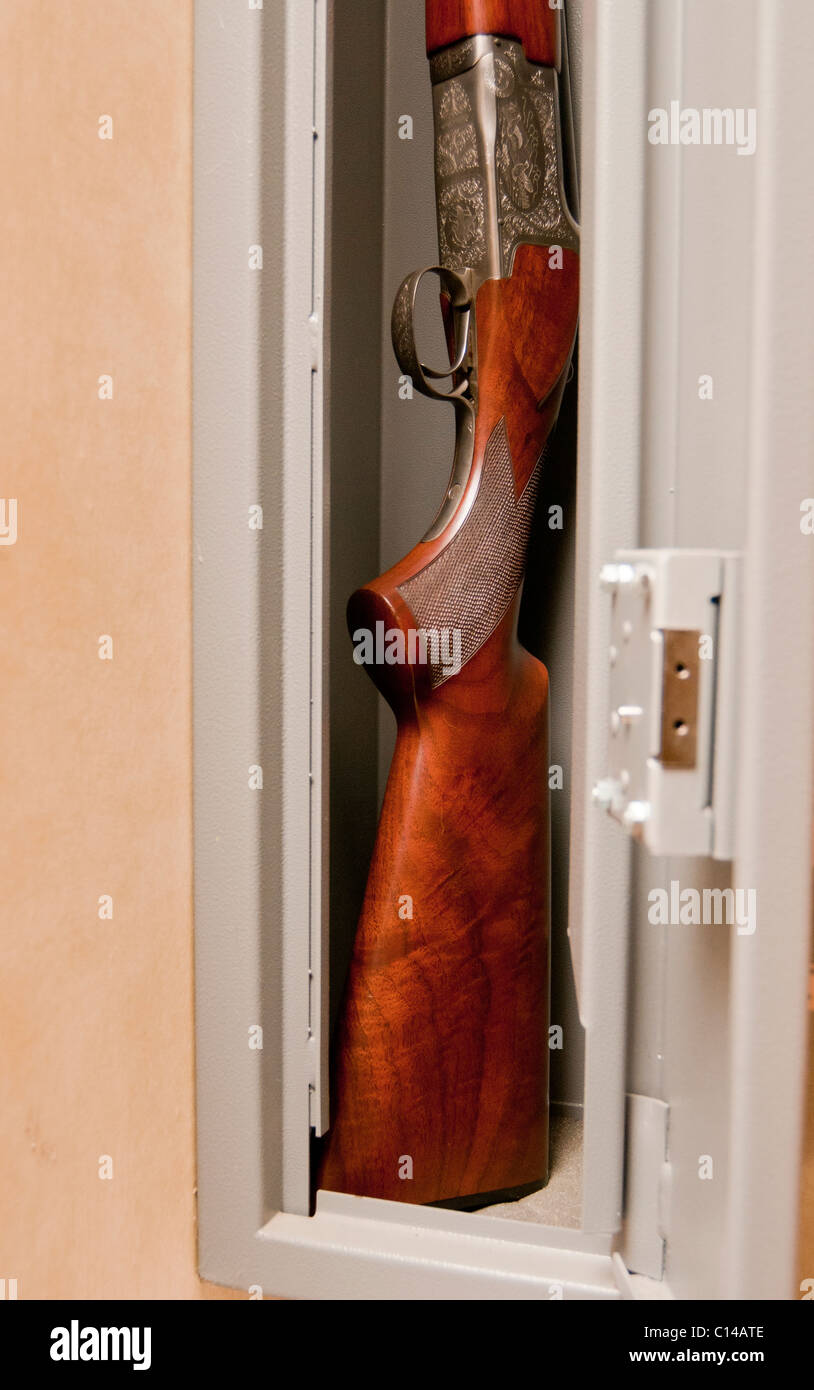 A Twelve Bore Shot Gun Stored In A Secure Gun Cabinet Stock Photo