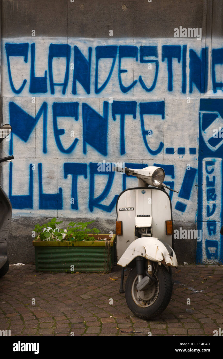 Vespa Piaggio scooter and graffiti central Naples Campania Italy Europe Stock Photo