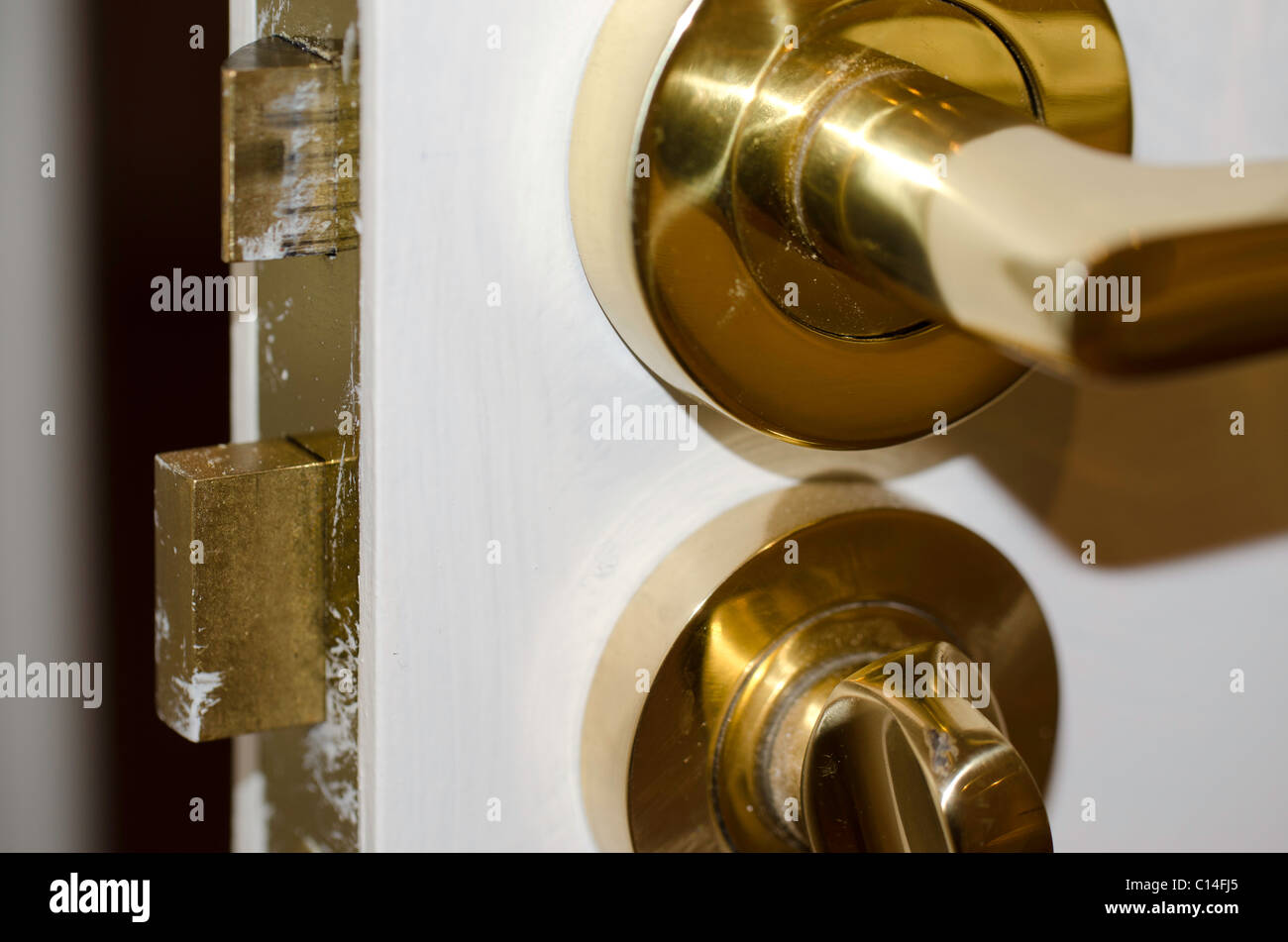 Brass door handle with locking device Stock Photo - Alamy