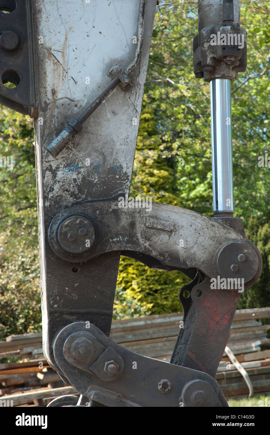 Close up of the mechanical workings of a hydraulic excavator arm Stock