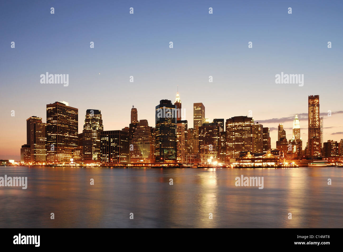 New York City Manhattan skyline at dusk over Hudson River with ...