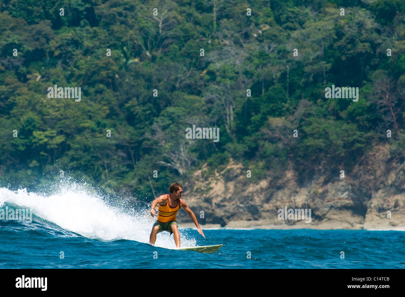 A young man surfing in Costa Rica Stock Photo