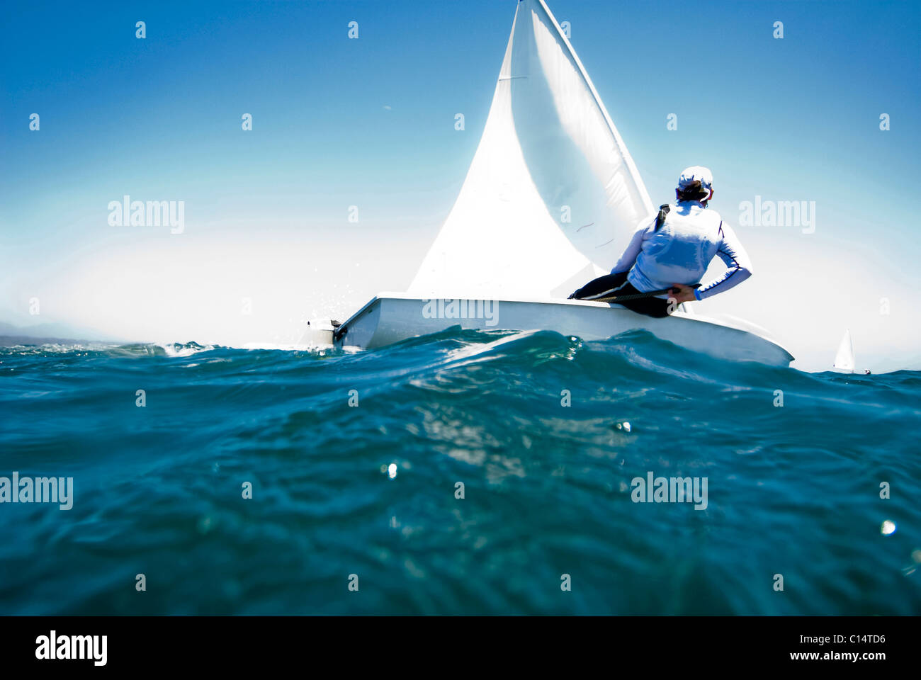 A female athlete races a boat during a training session in Mexico. Stock Photo
