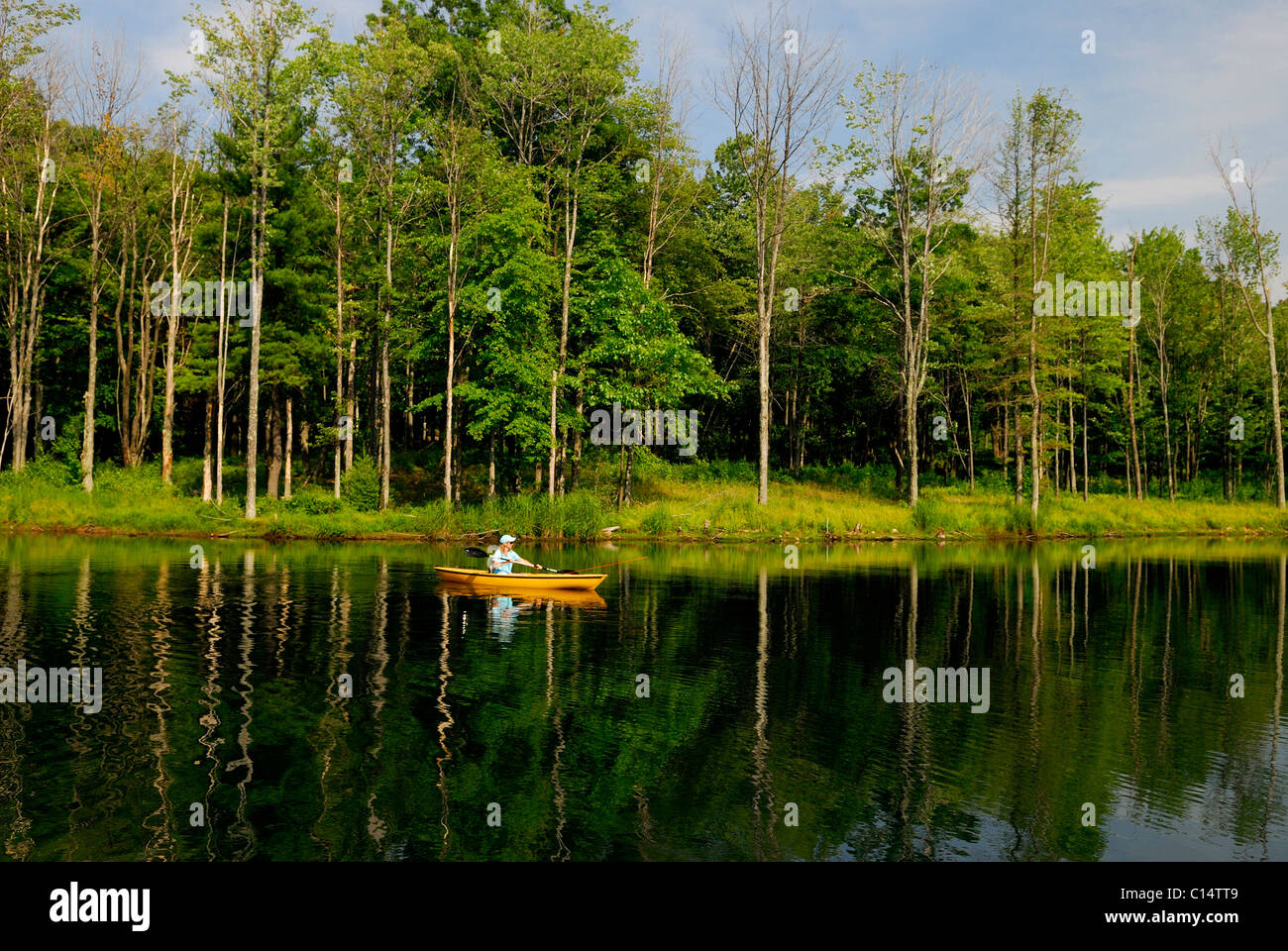 woman fly fishing in kayak Stock Photo Alamy