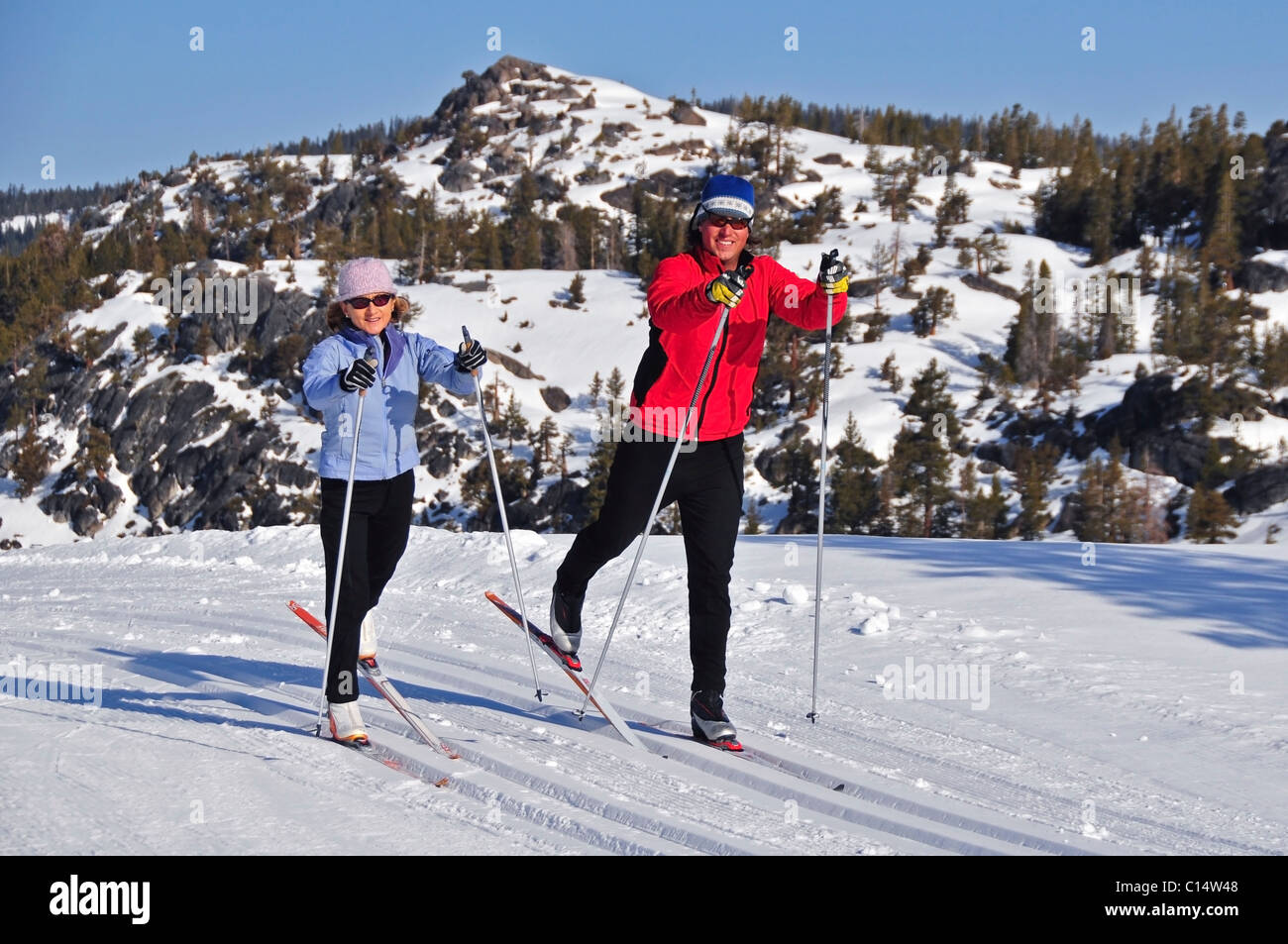 A man and woman cross country ski at Kirkwood Mountain Resort