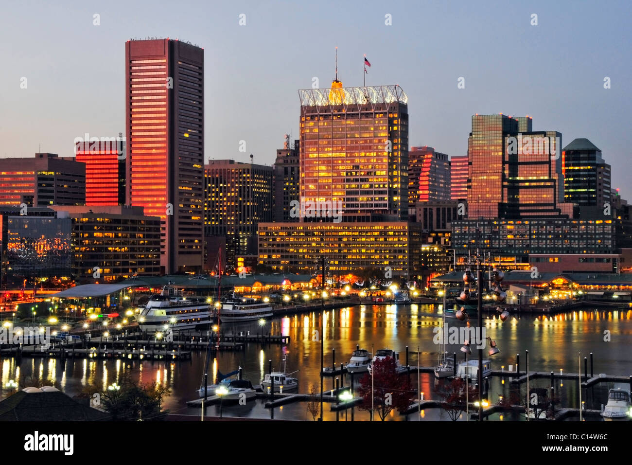 The sunset reflects off the windows of the Baltimore city skyline at
