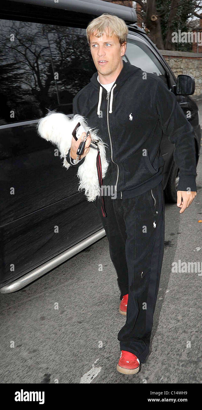 Kian Egan of Westlife leaving his car, carrying his dog Dublin, Ireland
