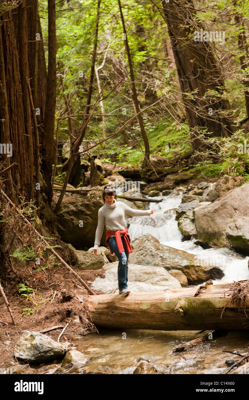 Woman hiking on the Hare Grove Trail in Limekiln State Park in Big Sur, California. Stock Photo