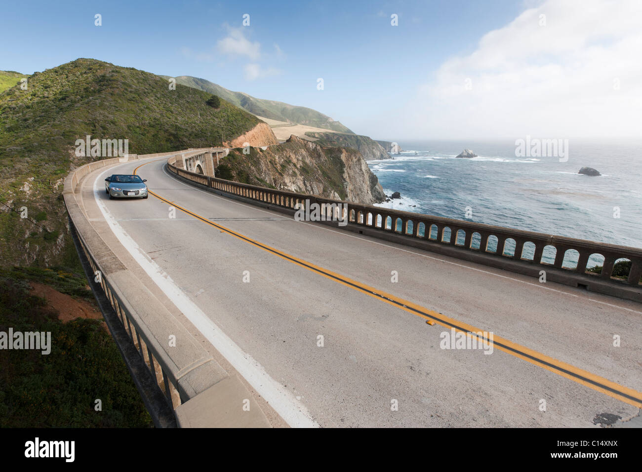 Convertible car, automobile on Bixby Bridge in Big Sur, Central Coast California. Stock Photo