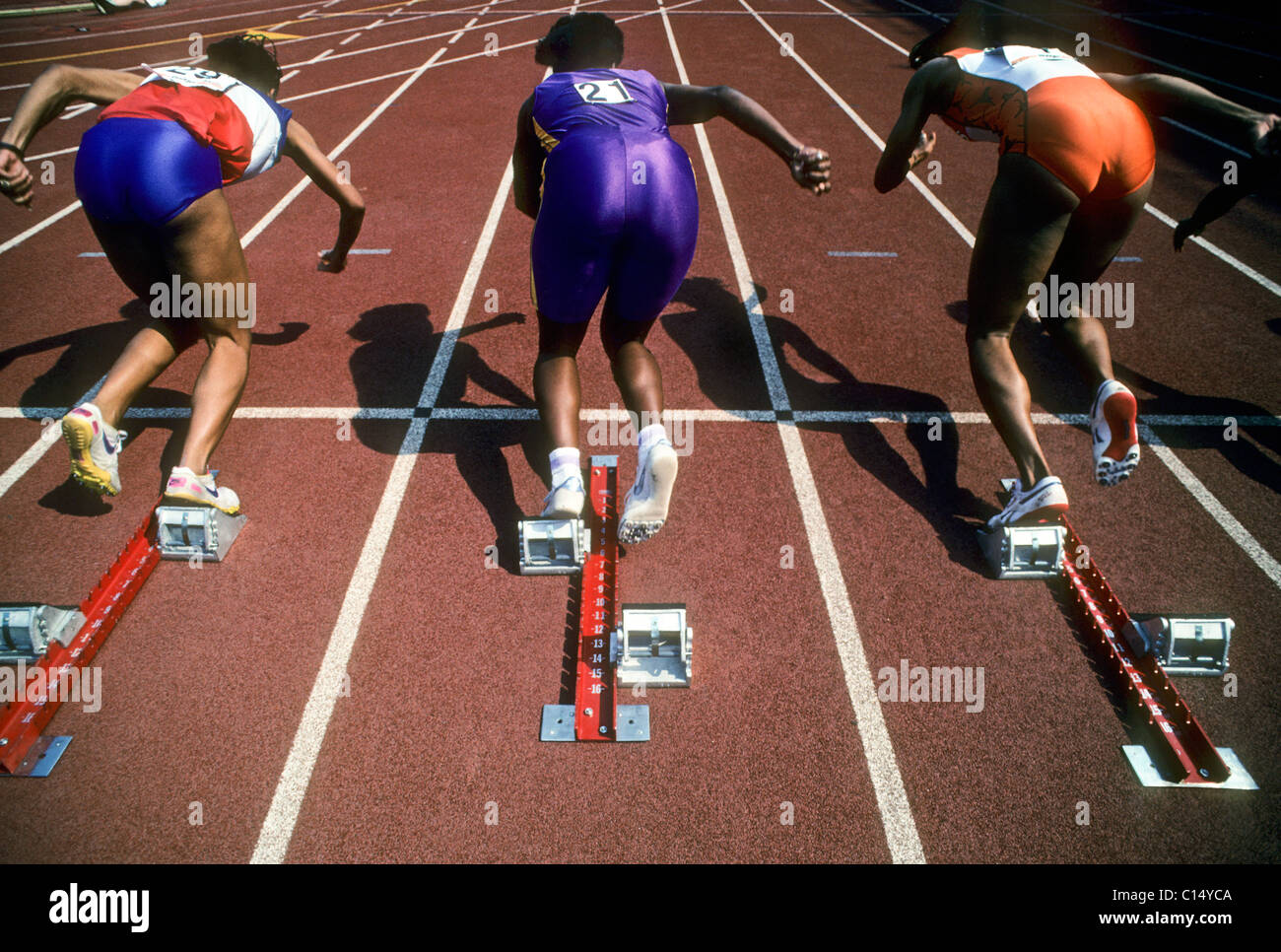 Start of women's 100 meter sprint race. Stock Photo