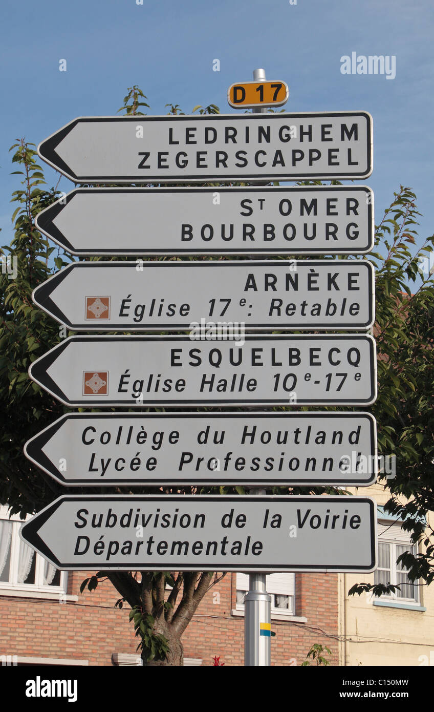 Typical French road signs on the D17 in the centre of the pretty French town of Wormhout, France. Stock Photo