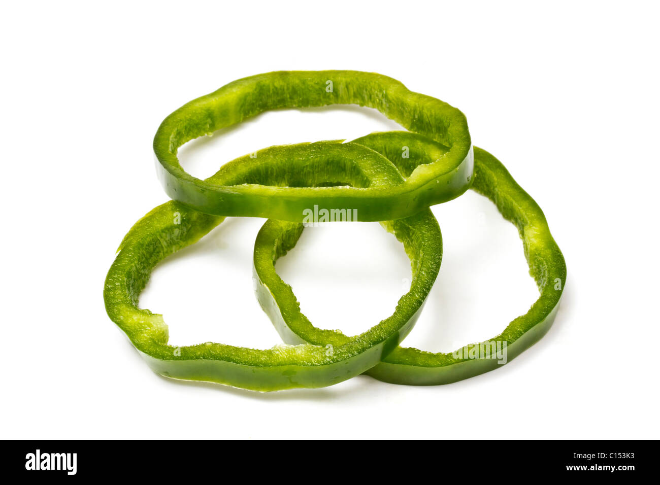 Sliced green pepper on white background Stock Photo - Alamy