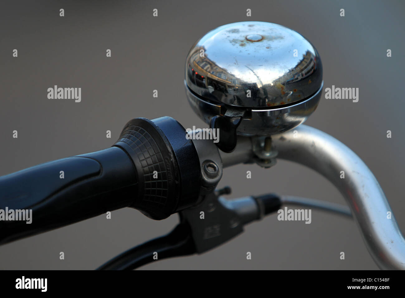 Bicycle bell pictured attached to handle bars in Hove, East Sussex, UK. Stock Photo