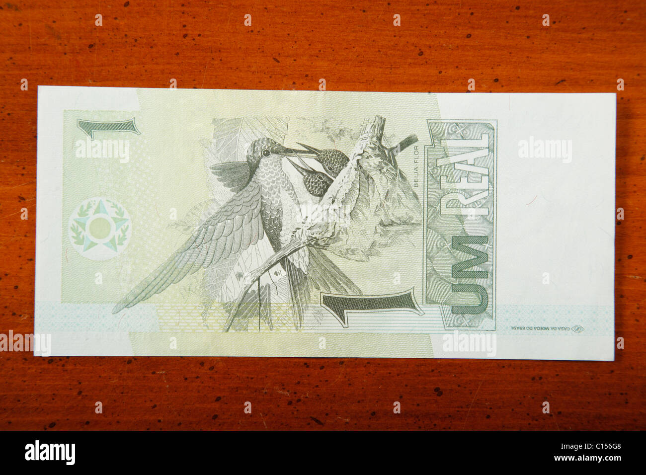 one Brazilian real currency bill on a table Stock Photo