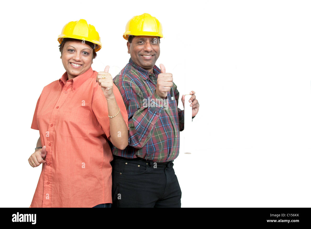 Construction colleagues giving thumbs up after achieving the desired results. Stock Photo