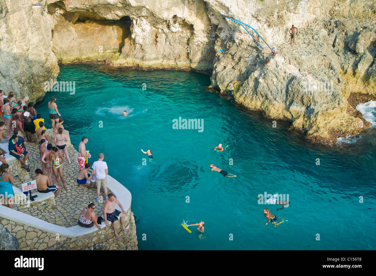Visitors dive in at Rick's Cafe, West End Negril, Jamaica Stock Photo
