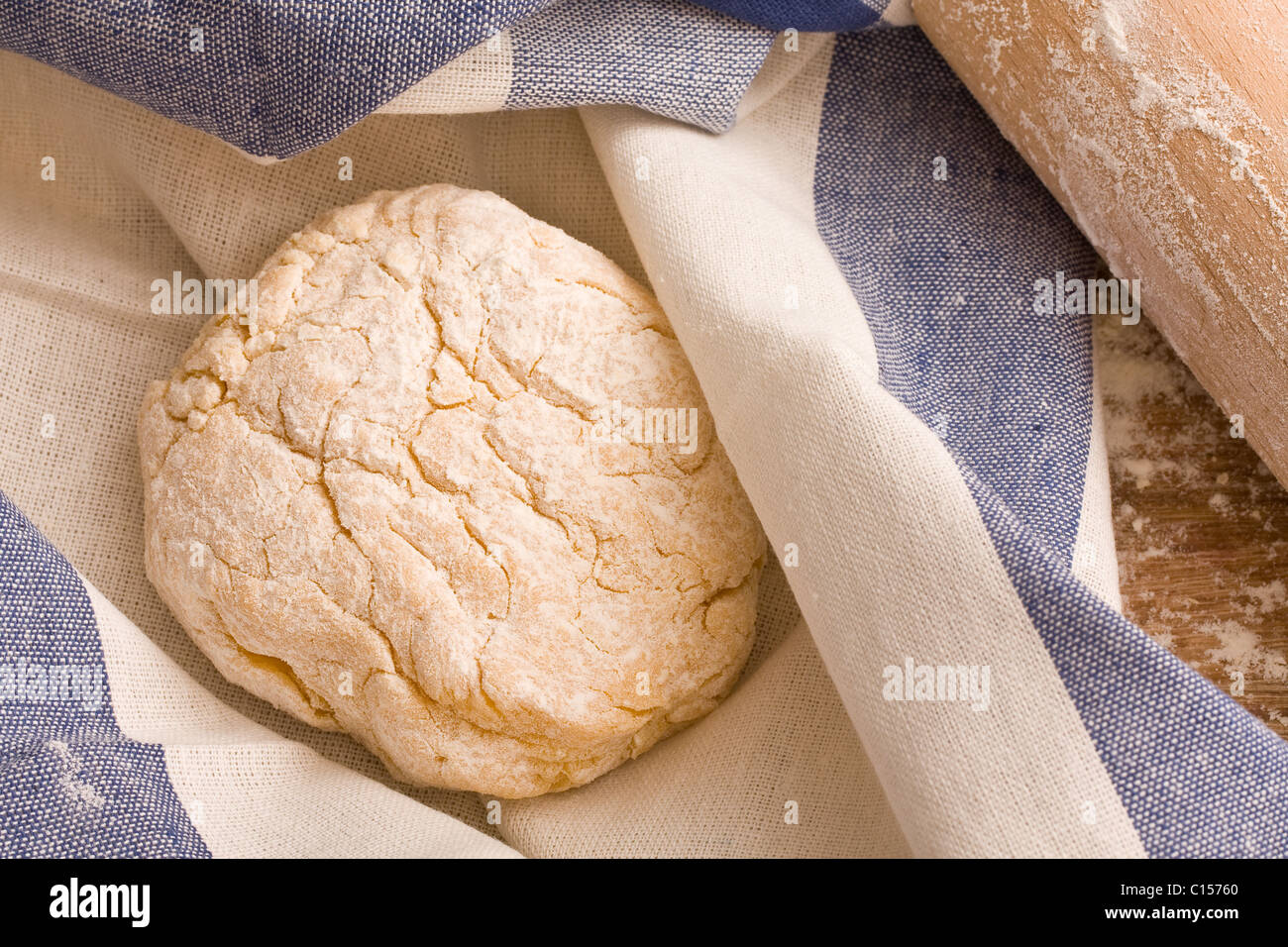 Fresh dough in towel with rolling pin Stock Photo Alamy