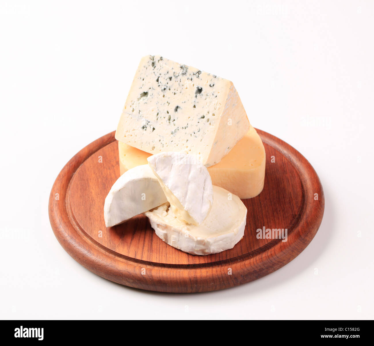 Selection of cheeses on a cutting board Stock Photo