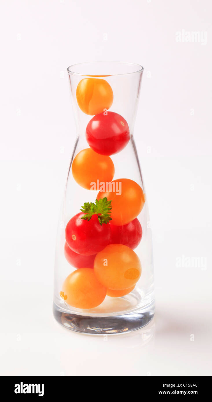 Red and yellow cherry tomatoes in a carafe Stock Photo - Alamy