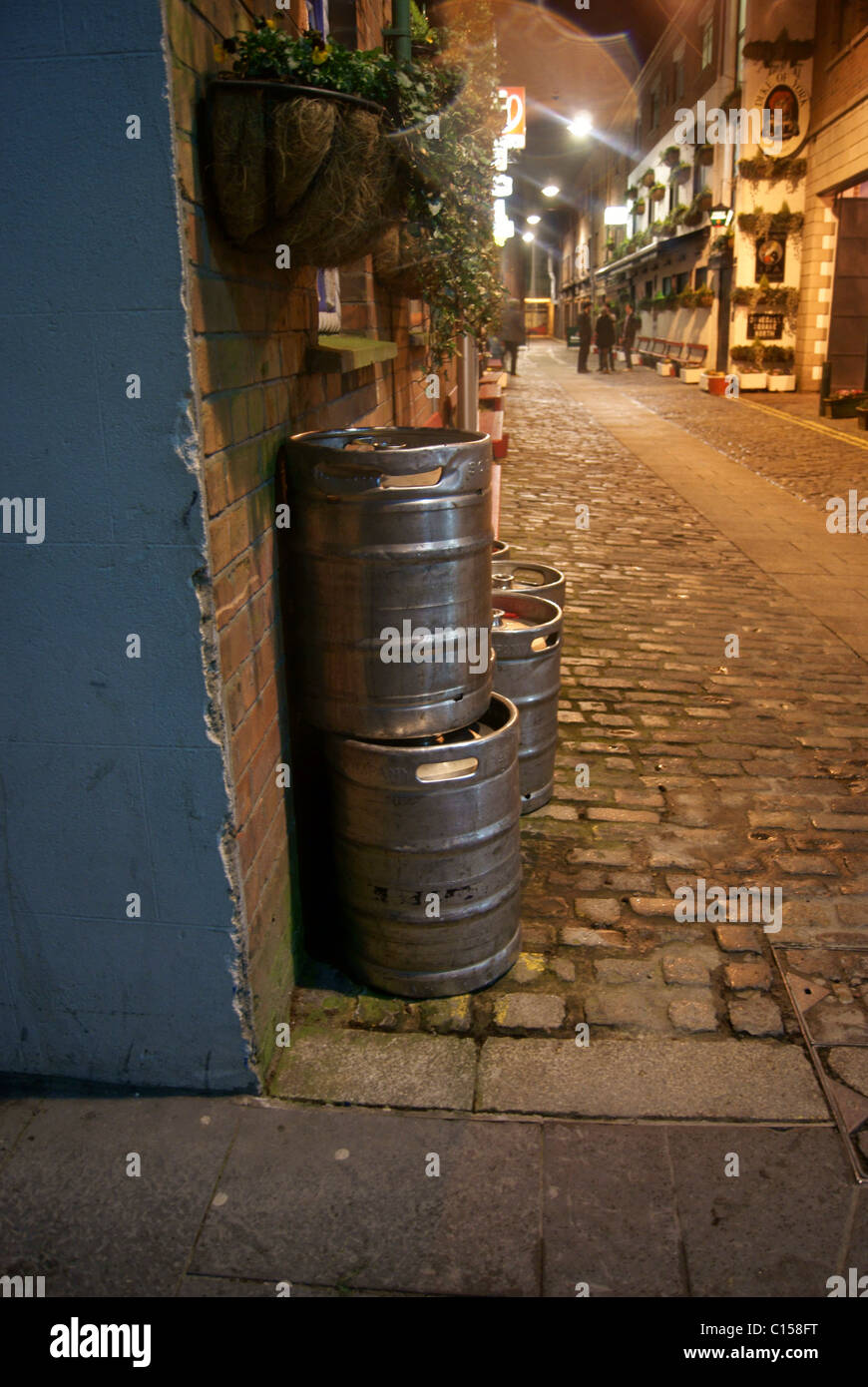 Beer Kegs In Cobbled Street. Stock Photo