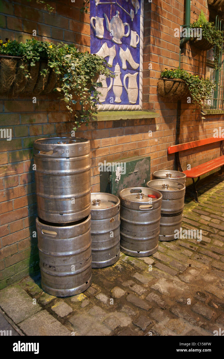 Beer Kegs Cobbles And Plants Stock Photo