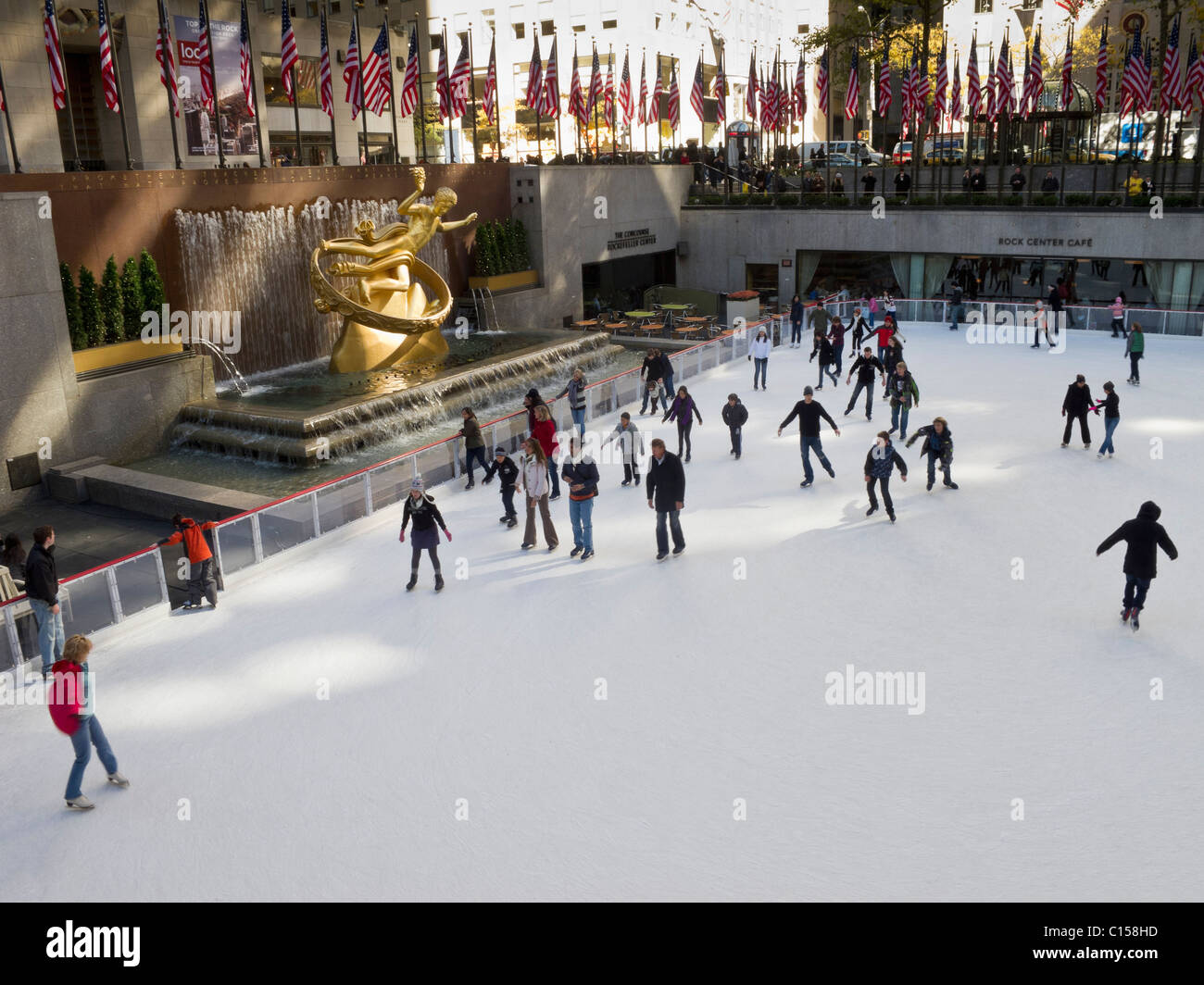Skaters at ice rink at Rockefeller Center in mid town Manhattan. Stock Photo