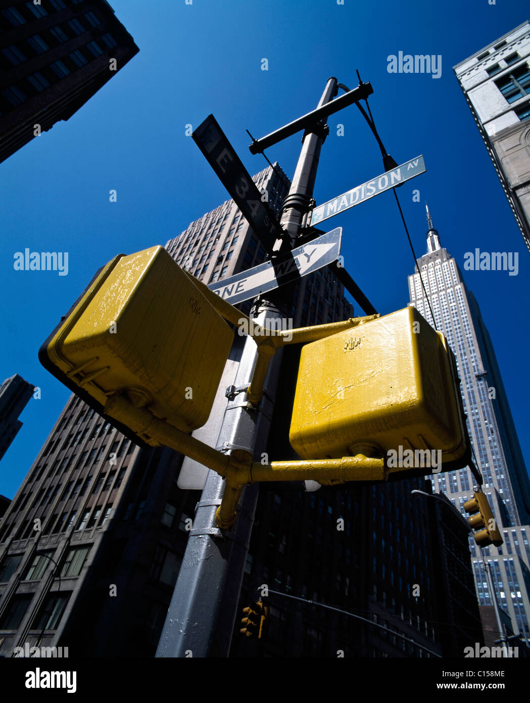 Traffic lights on Madison Avenue with Empire State Building Stock Photo