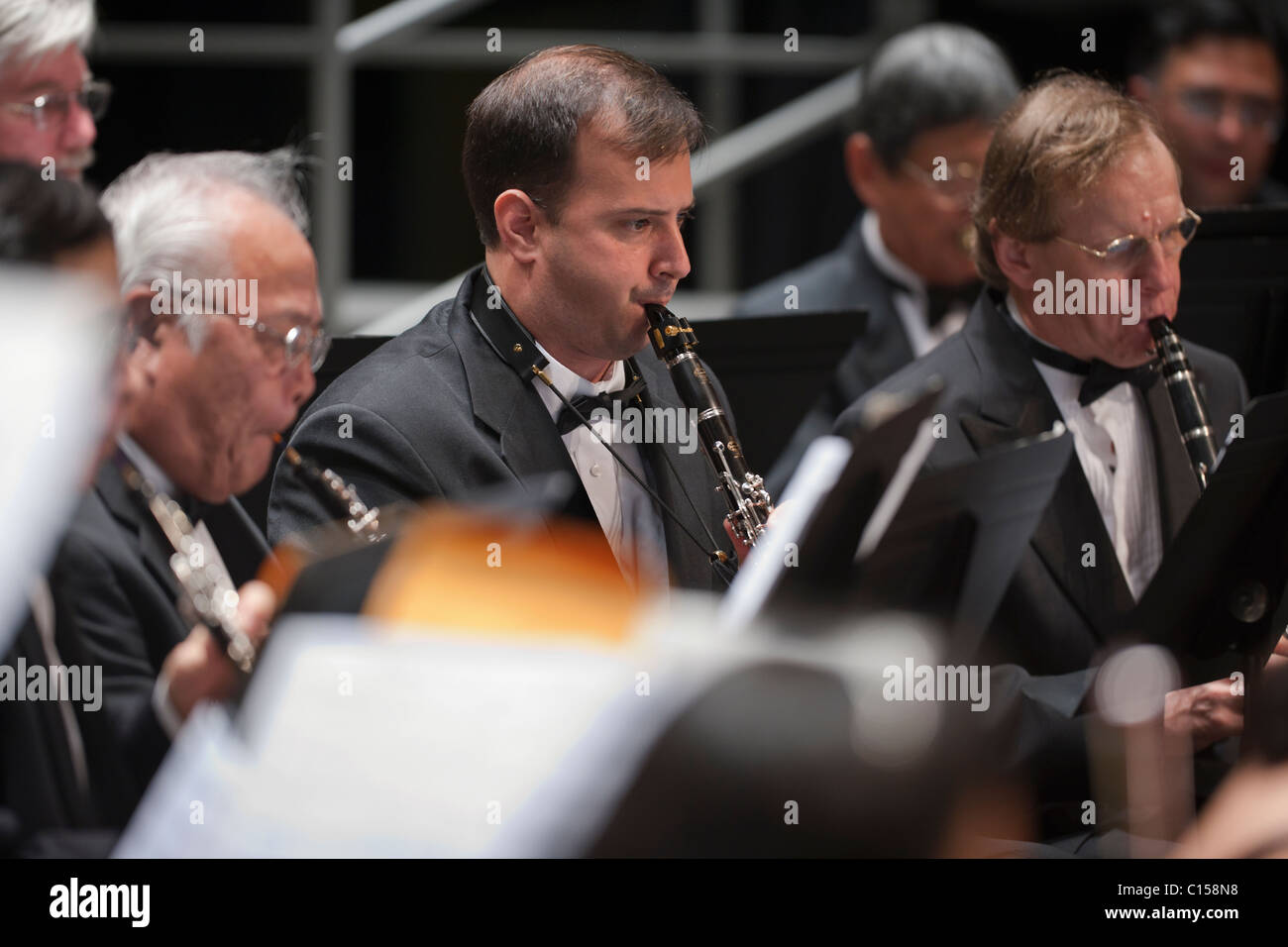 Clarinets and oboe in performance of classical orchestra (MR). Stock Photo