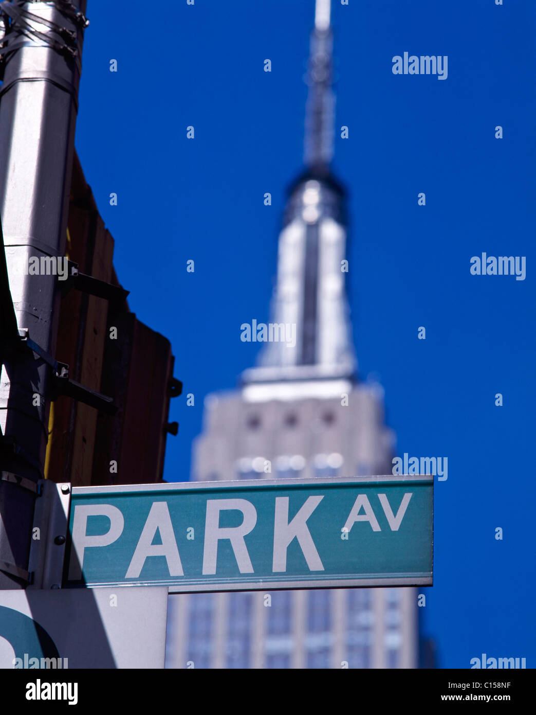 Park Avenue sign with Empire State Building in background Stock Photo