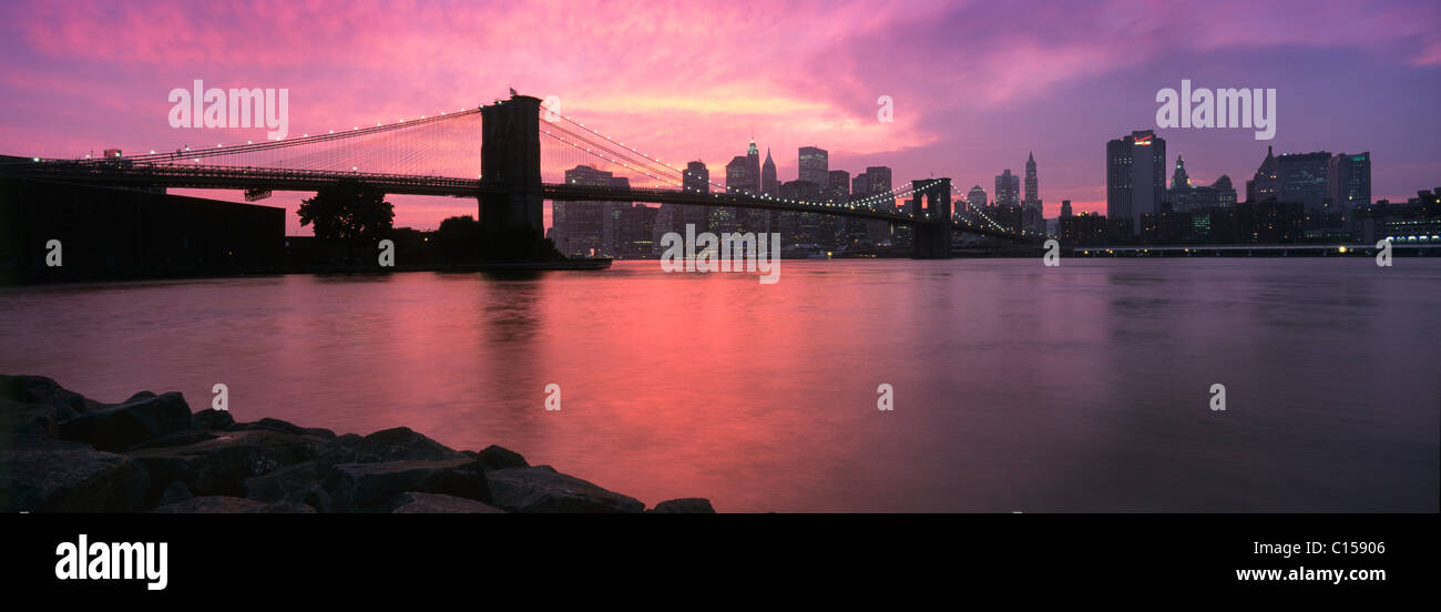 Sunset over Lower Manhattan and Brooklyn Bridge Stock Photo
