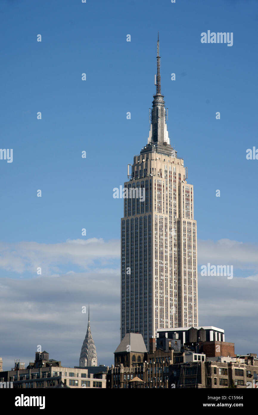 The Empire State Building in Midtown Manhattan with Chrysler Building in background Stock Photo