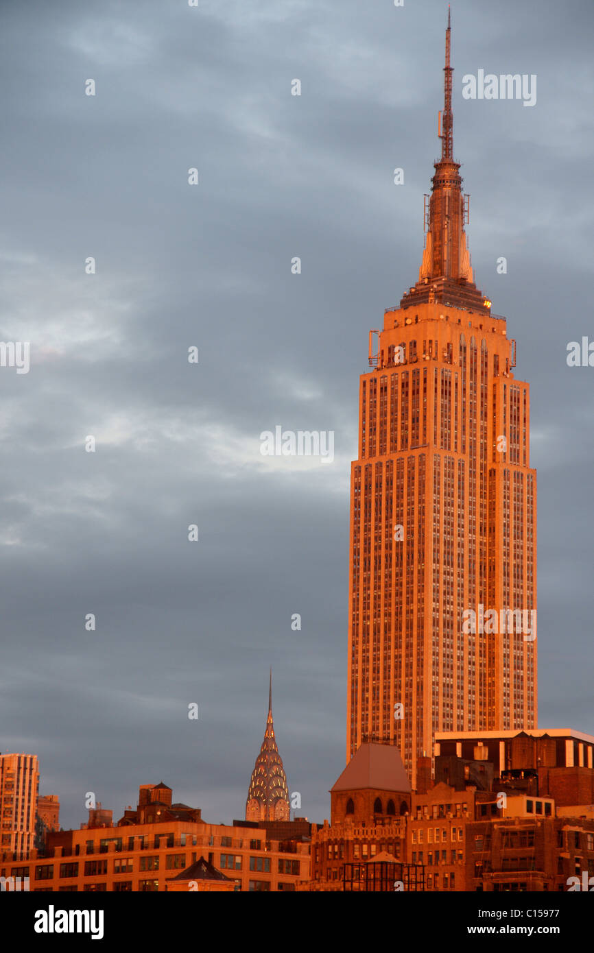 The Empire State Building with Chrysler Building in background at sunset Stock Photo