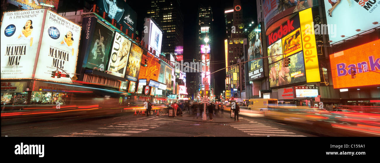 Times Square in Midtown Manhattan illuminated at night Stock Photo