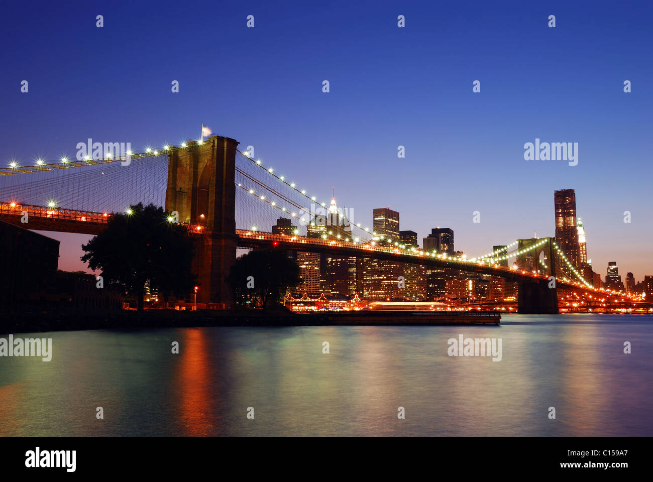 Brooklyn Bridge with New York City Manhattan skyline at dusk over East ...