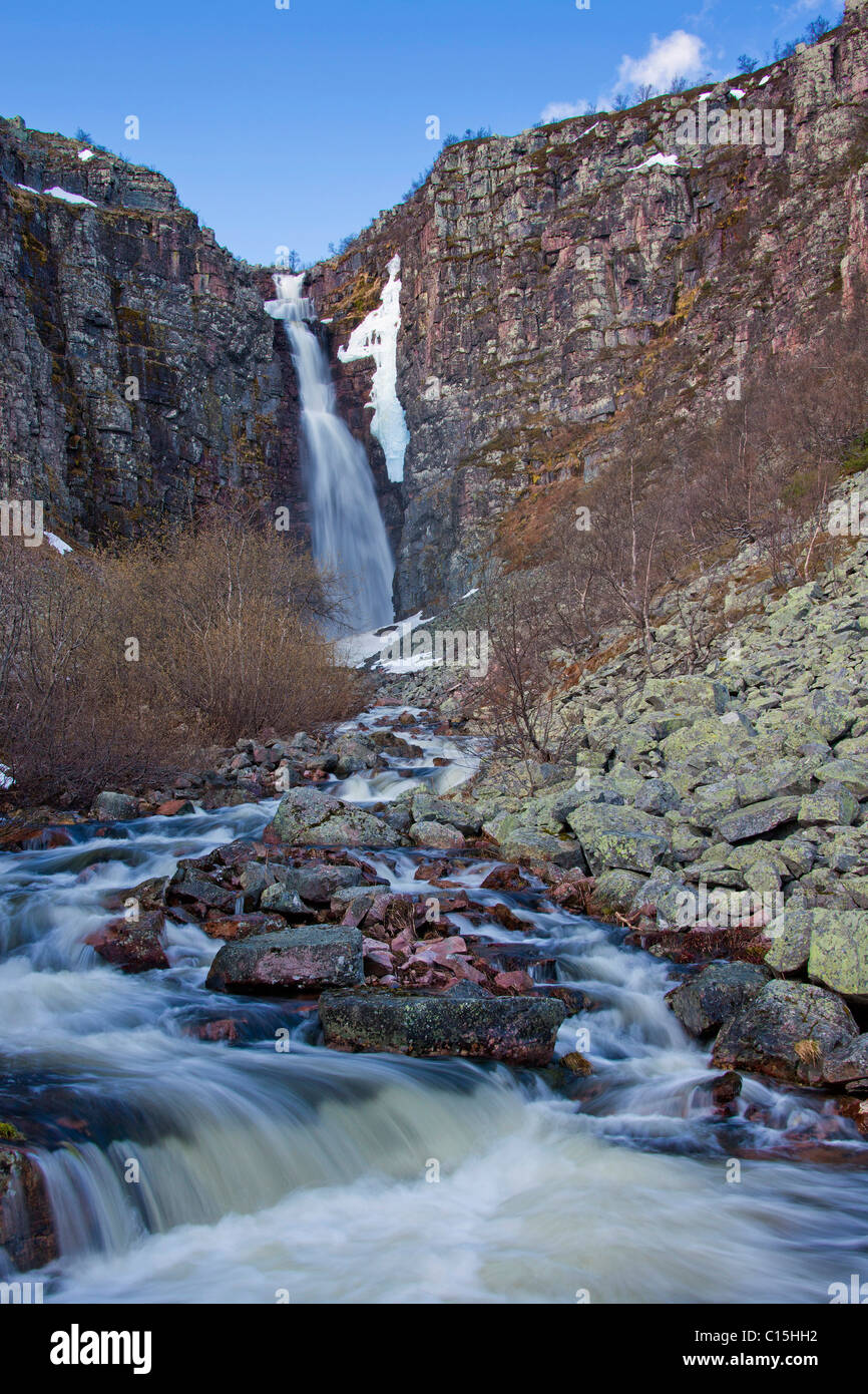 Hidden in a deep canyon is Swedens largest waterfall: The 93 m high Njueskaer has a free fall of 70 metres Stock Photo
