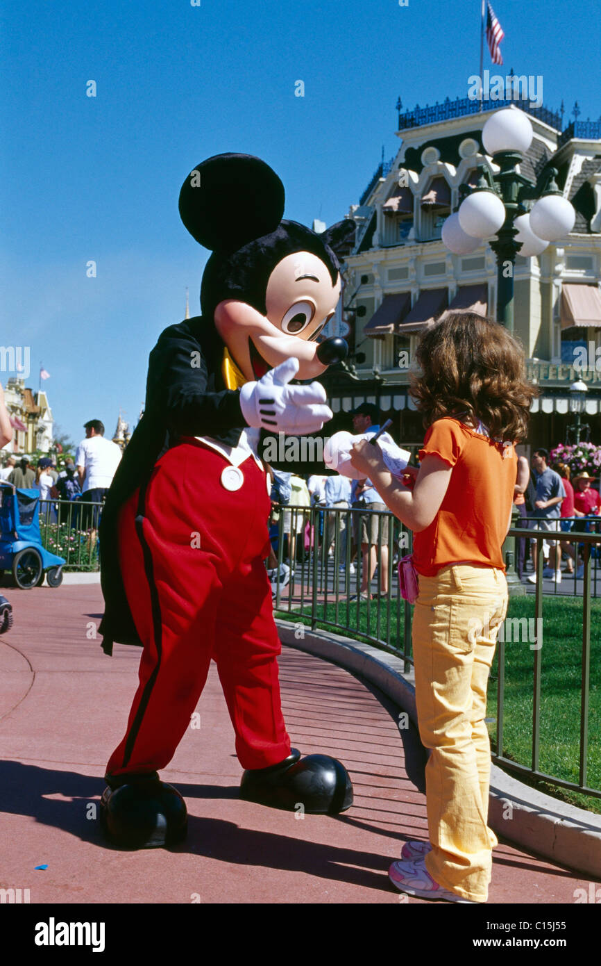 Mickey Mouse giving a girl his autograph, Disneyworld, Disney World, Orlando, Florida, USA Stock Photo