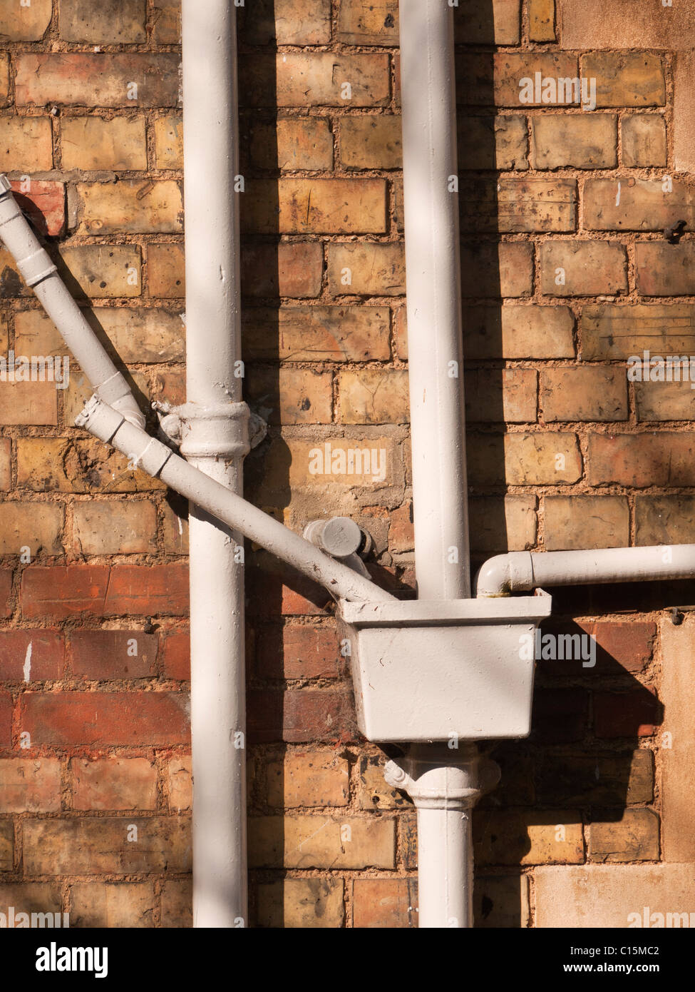 Drain pipes on 19th century brick building Stock Photo