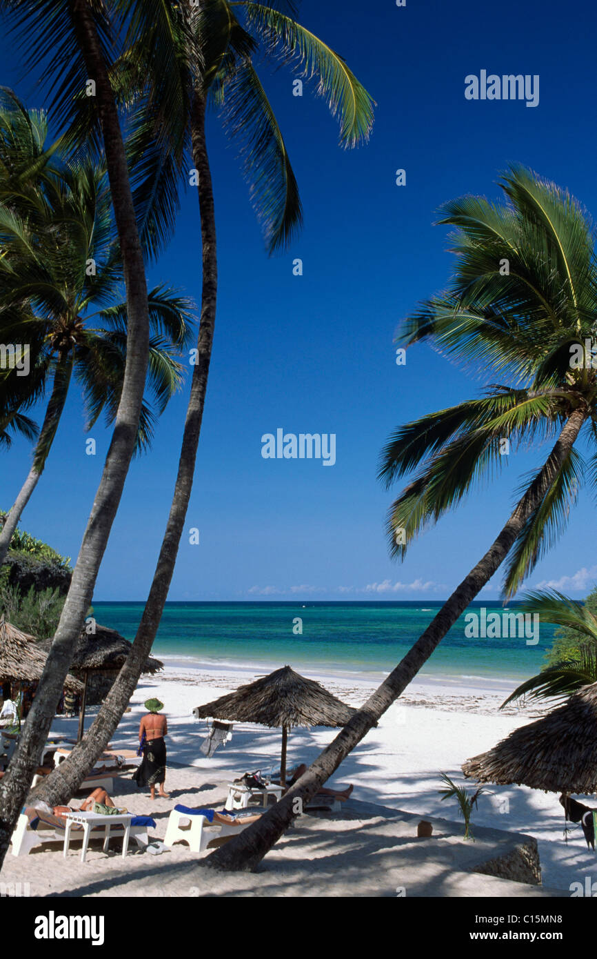 Palm trees and tourists at Diani Beach at Leisure Lodge Hotel, Kenya, Africa Stock Photo