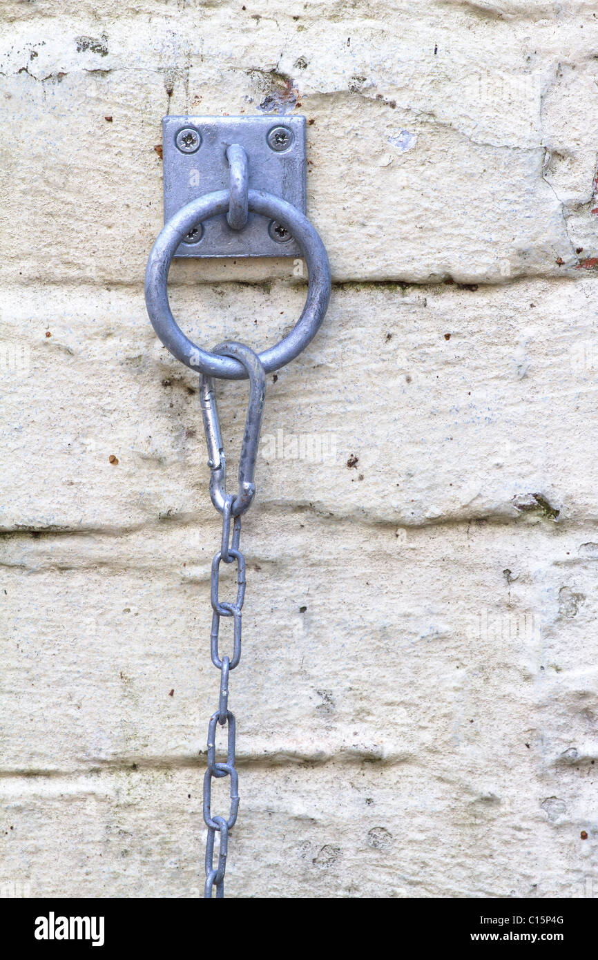 Steel chain on wall Stock Photo Alamy