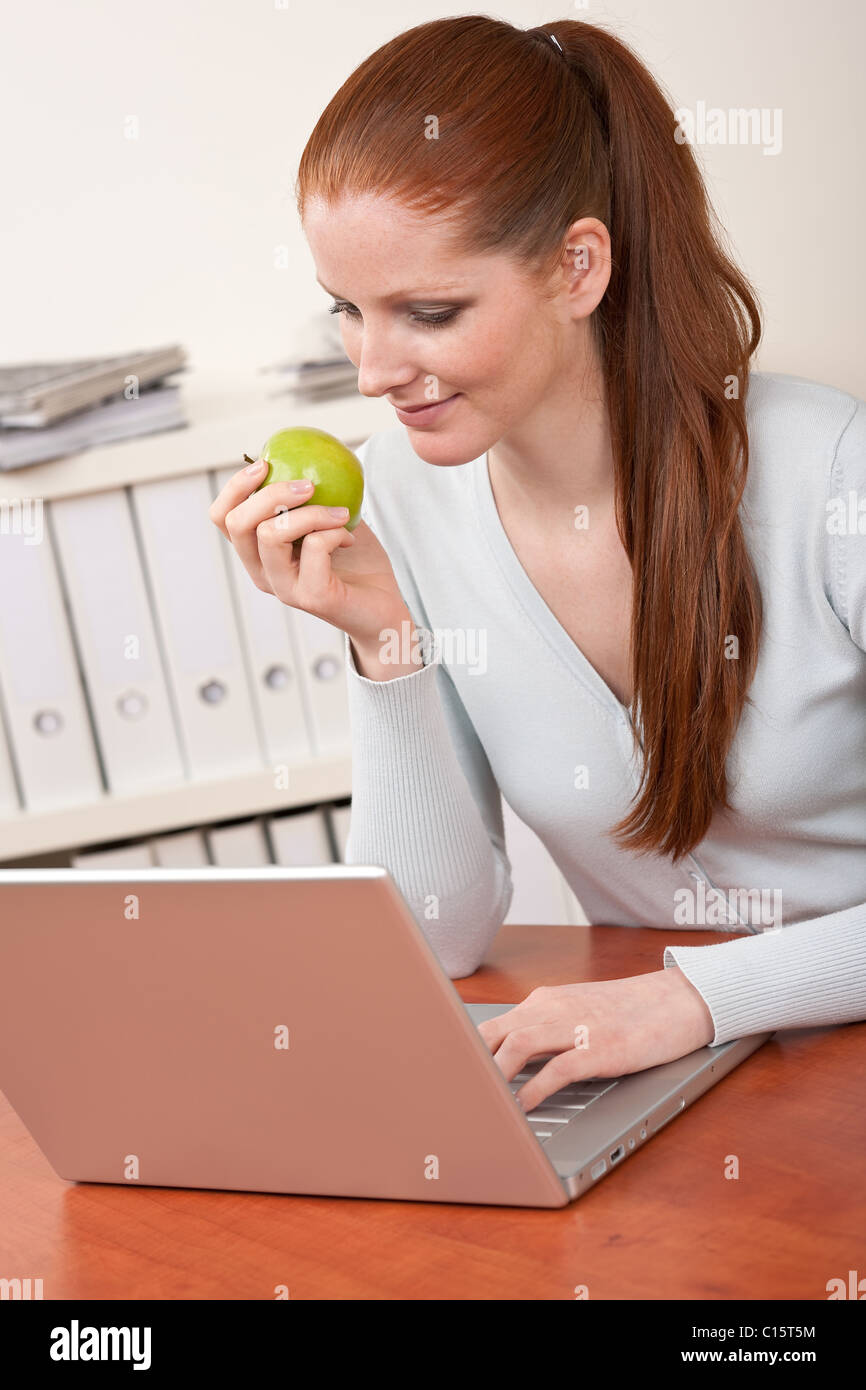 Young business woman working at office with laptop Stock Photo - Alamy
