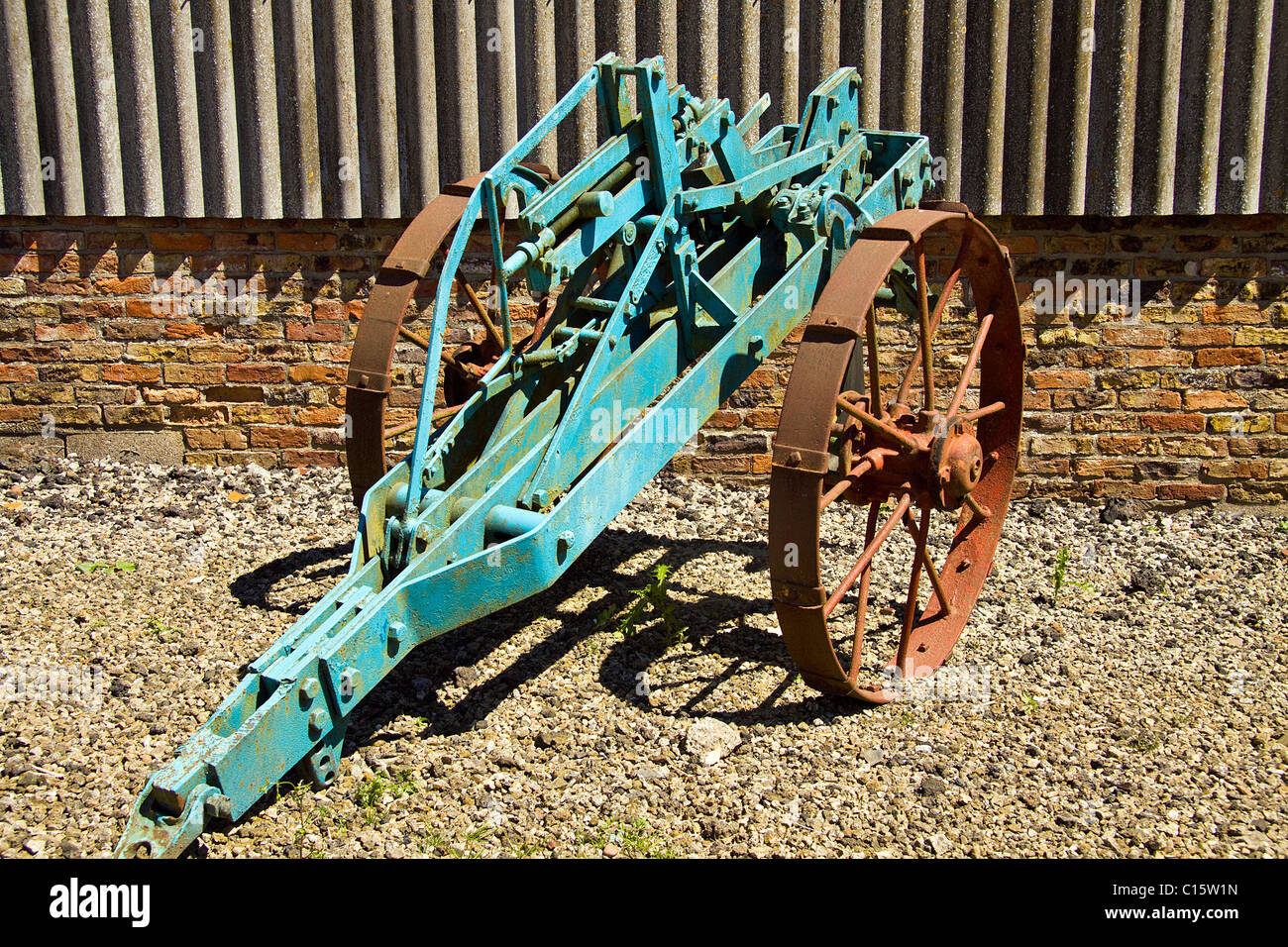 Early plough for laying drainage pipes - museum piece Stock Photo