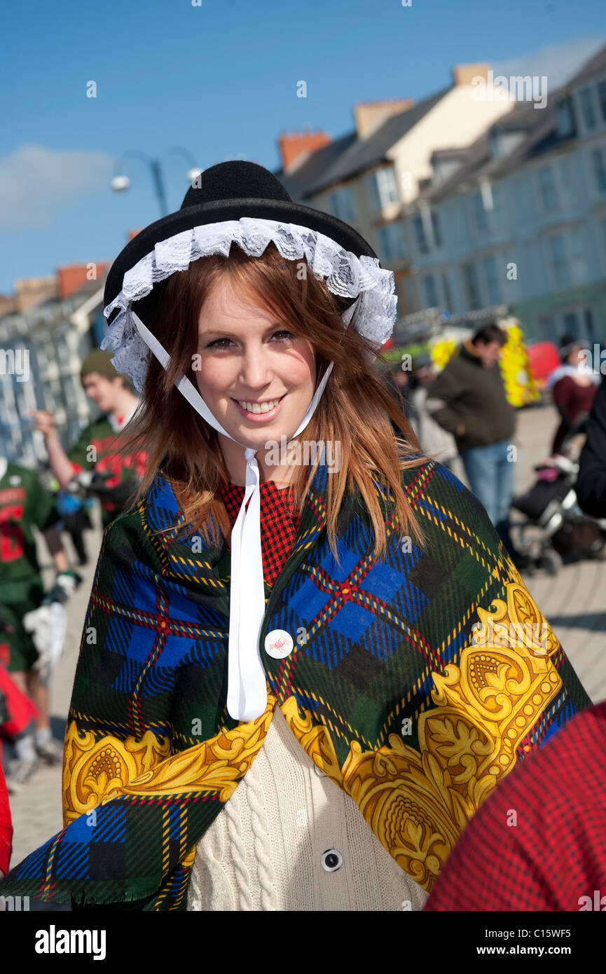 A young woman dressed in traditional welsh costume on St Davids Day