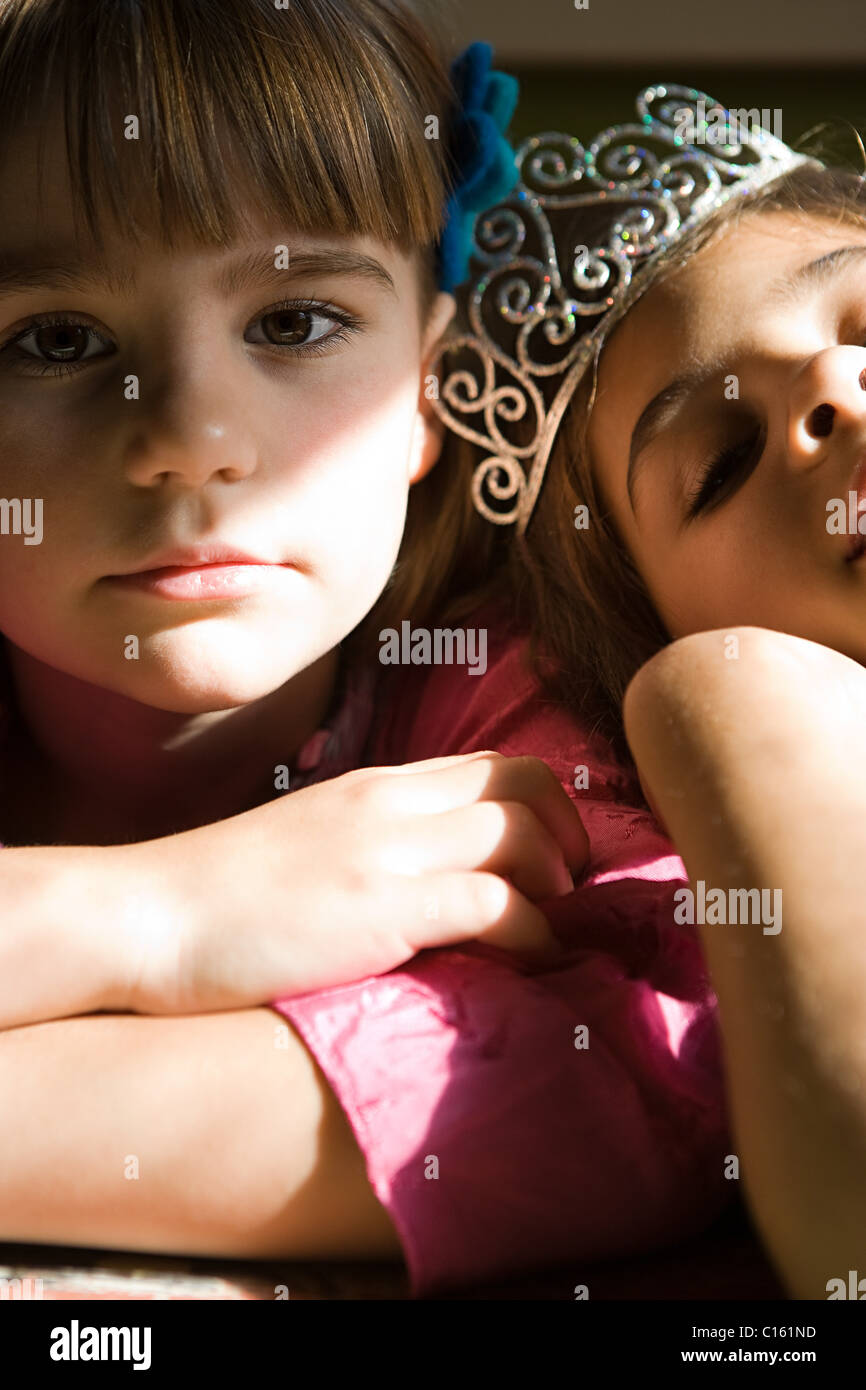 Two girls, one wearing tiara Stock Photo
