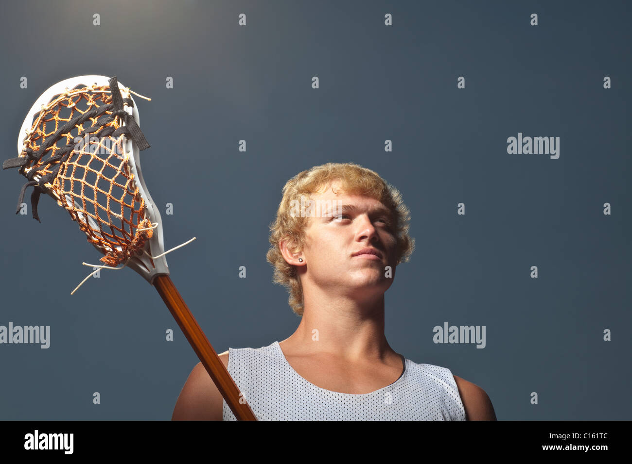 Lacrosse player with lacrosse stick Stock Photo Alamy
