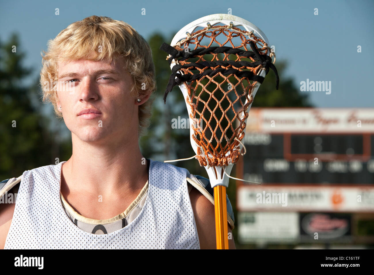 Lacrosse player with lacrosse stick Stock Photo Alamy