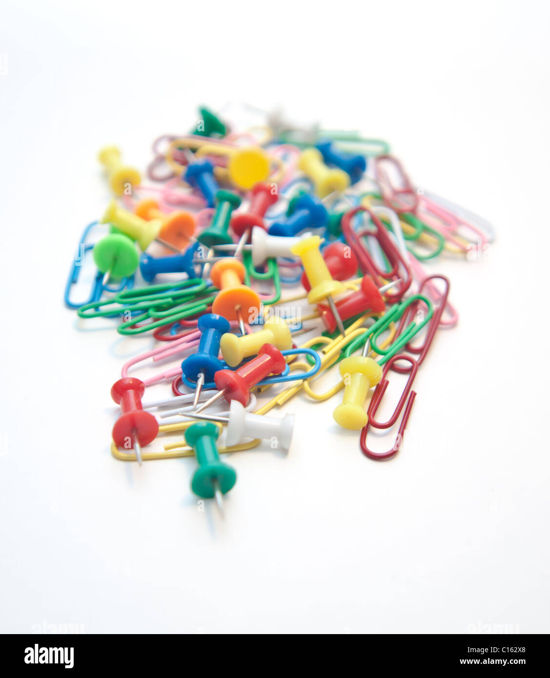 Group of paper clips and pins on white Stock Photo Alamy