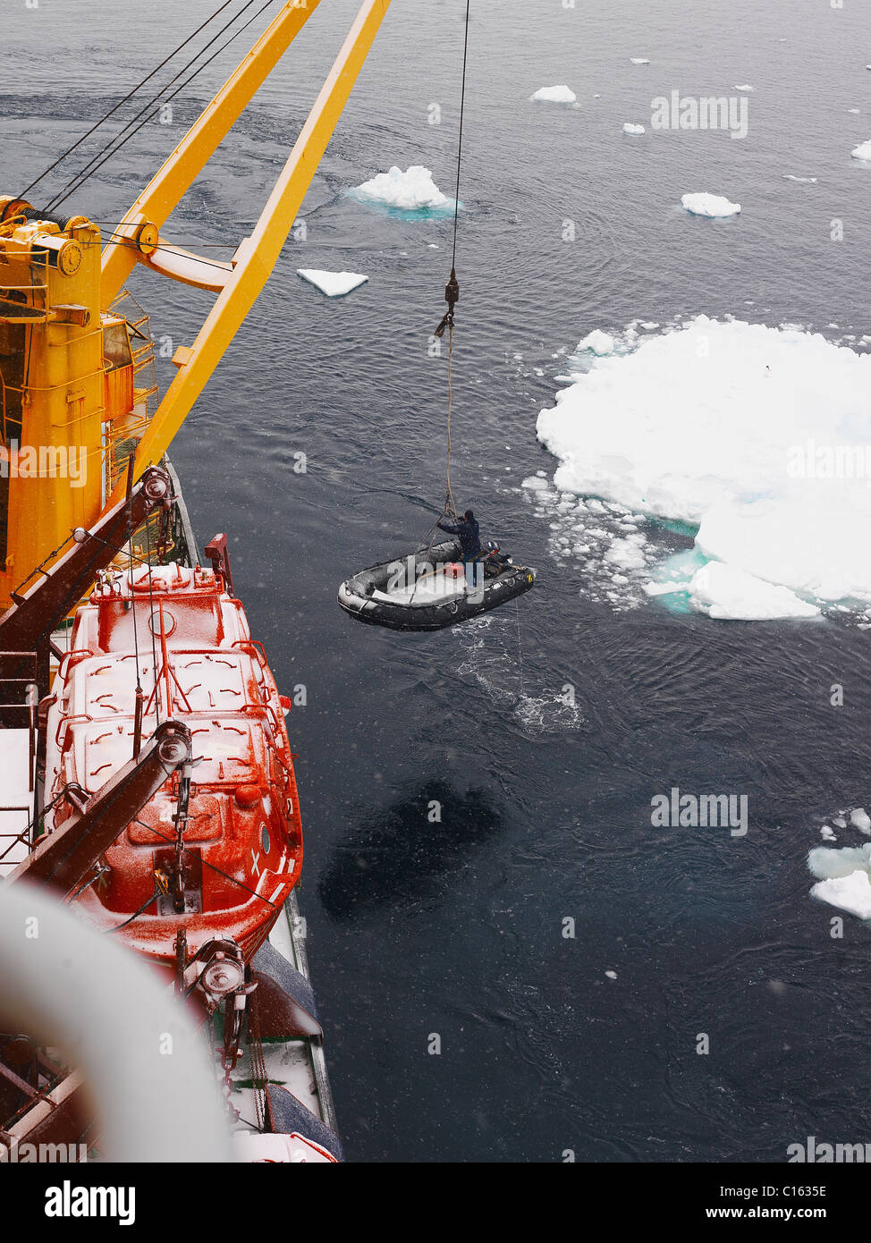 Dinghys approaching after a landing attempt at Cape Adare, Ice Breaker