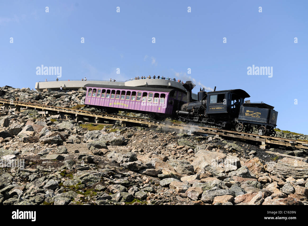 Mt. Washington Steam Train cog railway takes tourists up to observatory Stock Photo