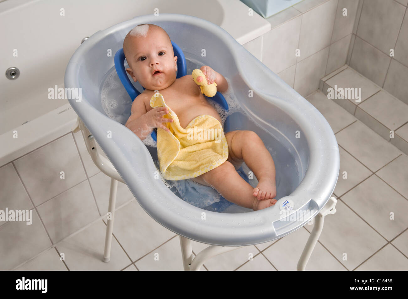 Baby in a bathtub Stock Photo