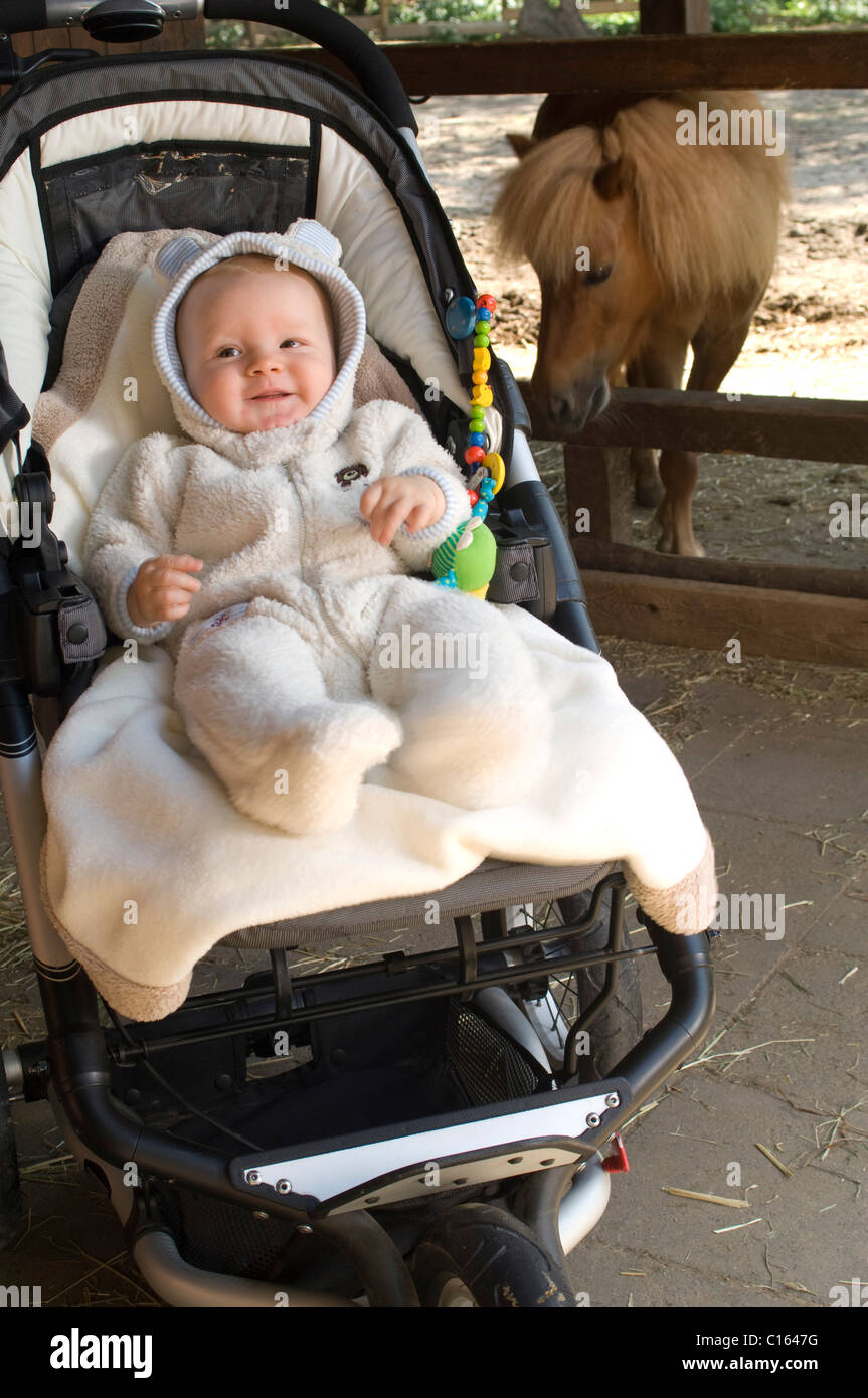 Baby clothed in a winter outfit Stock Photo